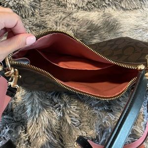 Coach purse with shoulder strap and crossbody strap. No damage.